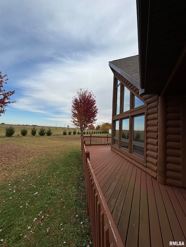 view of yard featuring a rural view and a deck