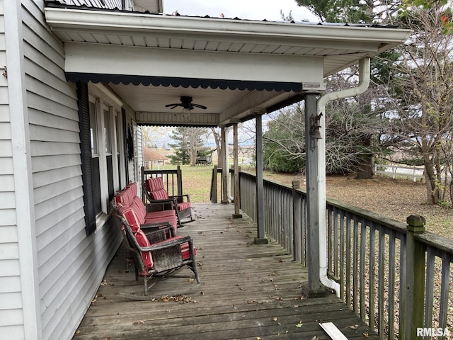 deck with ceiling fan and a porch