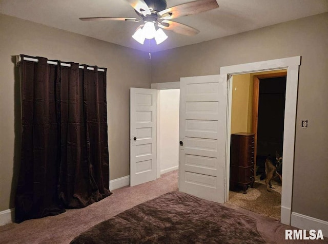 carpeted bedroom with ceiling fan and a closet