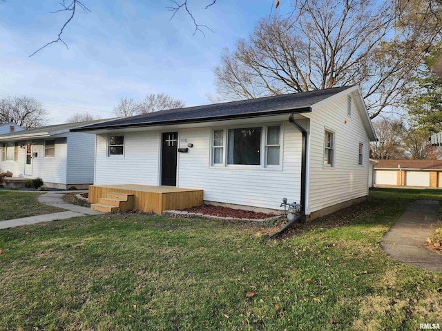 ranch-style house with a front lawn