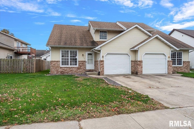 view of front of house featuring a garage and a front lawn