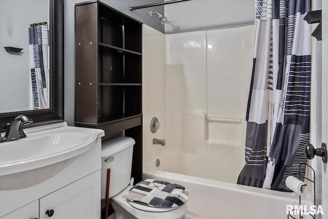 full bathroom featuring shower / bathtub combination with curtain, vanity, and toilet