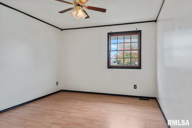 spare room with ceiling fan, light hardwood / wood-style flooring, and a textured ceiling