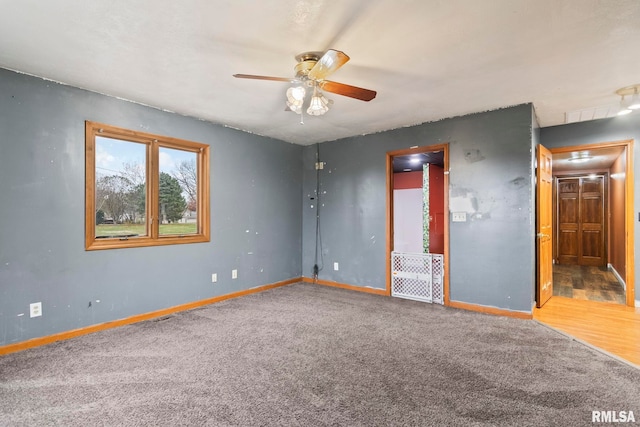 unfurnished room featuring hardwood / wood-style floors and ceiling fan