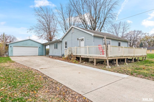 view of front of home with an outbuilding, a garage, and a deck