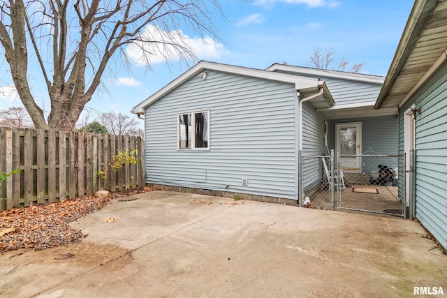 view of side of property featuring a patio area