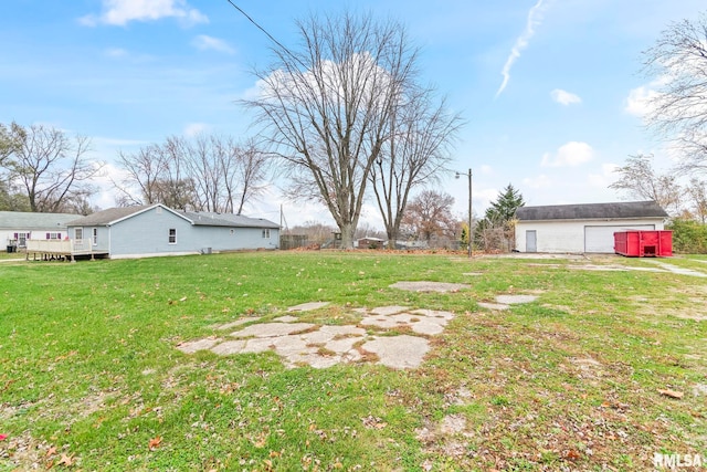 view of yard featuring an outbuilding and a garage