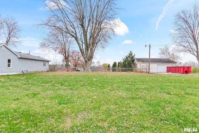 view of yard featuring an outbuilding and a garage