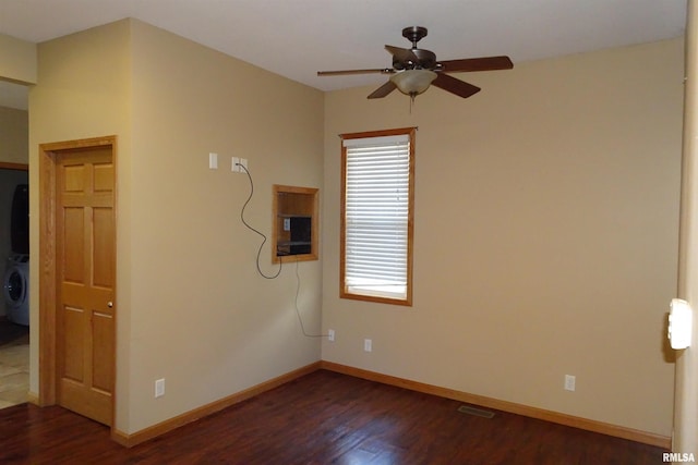 1130 Adams St, Quincy, IL 62301 - spare room with dark wood-type flooring and a ceiling fan