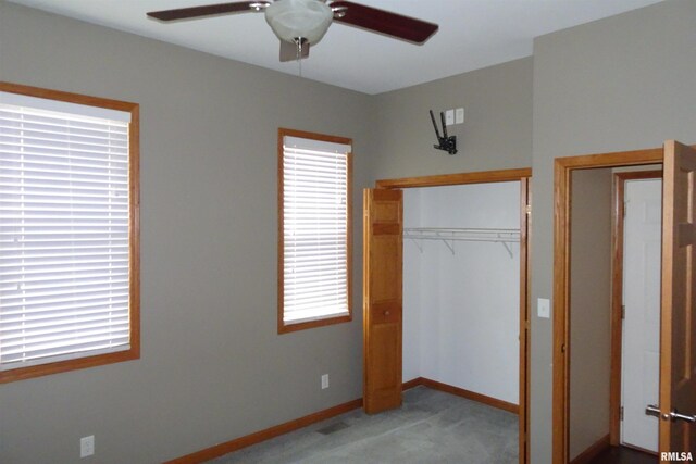1130 Adams St, Quincy, IL 62301 - unfurnished bedroom featuring carpet floors, a closet, and a ceiling fan