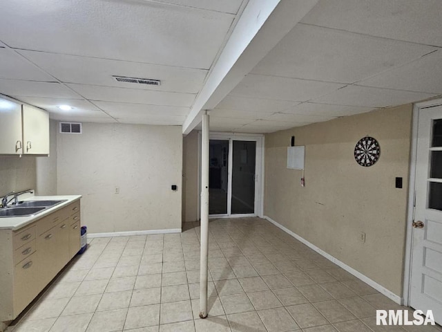 kitchen featuring sink and light tile patterned flooring