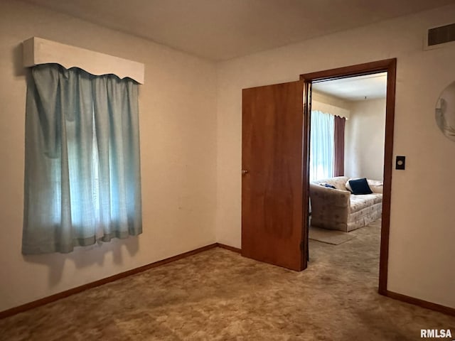 bedroom with light colored carpet