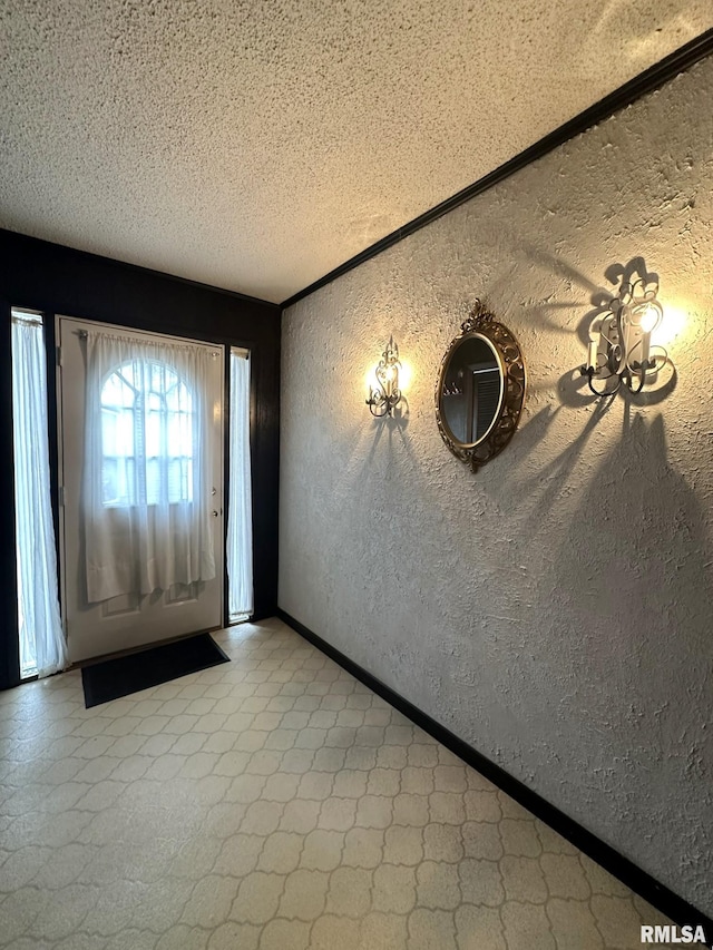 foyer entrance featuring a textured ceiling