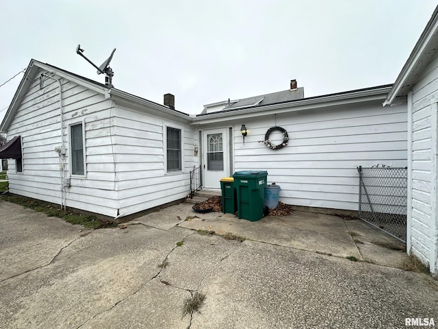 rear view of property featuring a patio area