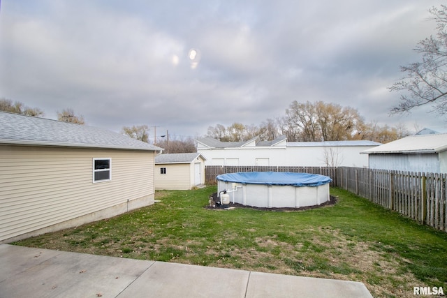 view of yard featuring a covered pool