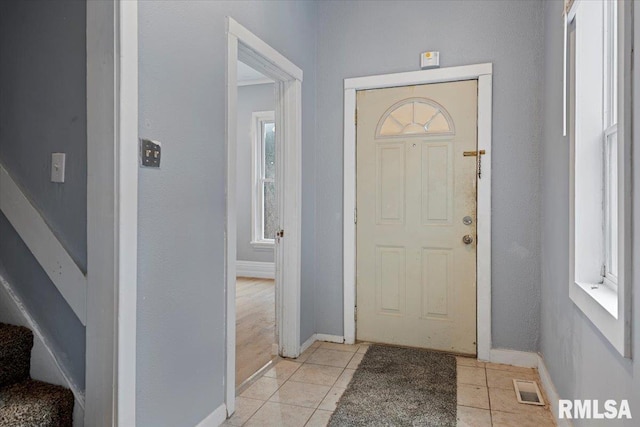 view of tiled foyer entrance