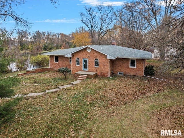 ranch-style house with a front lawn