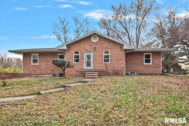 single story home featuring a front yard and central AC unit