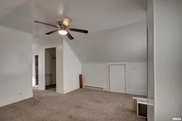 additional living space featuring a baseboard radiator, ceiling fan, lofted ceiling, and light colored carpet