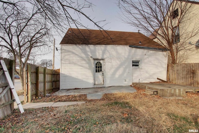 back of property with a patio