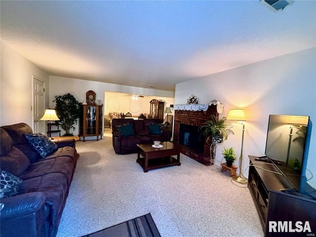 carpeted living room featuring a fireplace