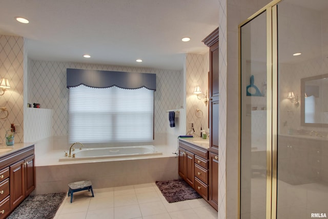 bathroom with tile patterned floors, vanity, and independent shower and bath