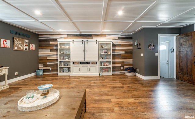 living room featuring hardwood / wood-style flooring and wood walls