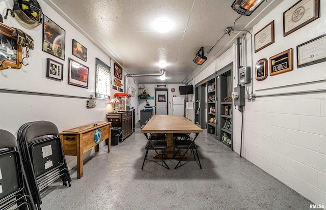 dining space with a textured ceiling