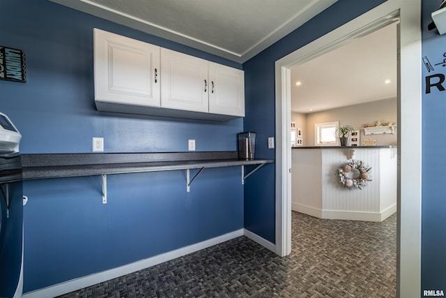 kitchen featuring white cabinets