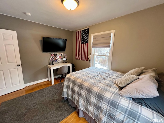 bedroom with hardwood / wood-style flooring