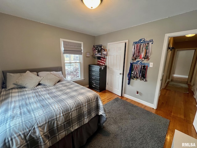 bedroom with wood-type flooring