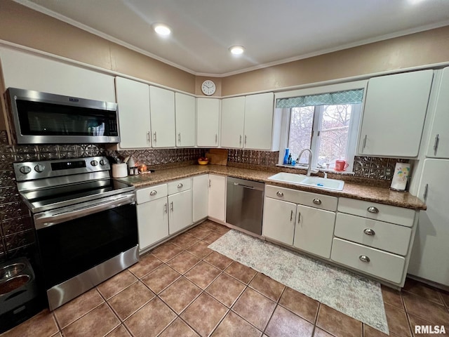 kitchen with white cabinetry, sink, crown molding, and appliances with stainless steel finishes