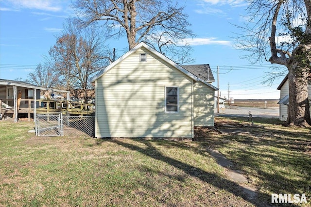 view of property exterior with a lawn