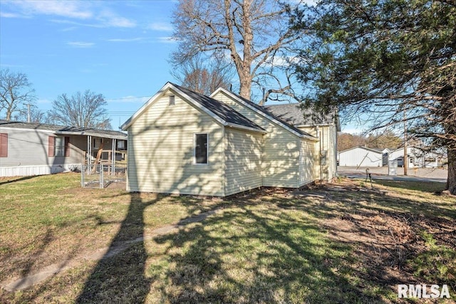 view of home's exterior featuring a yard