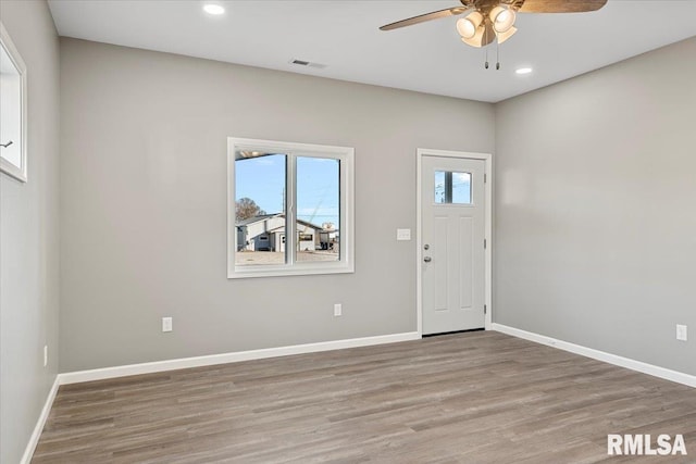 entryway with hardwood / wood-style flooring and ceiling fan