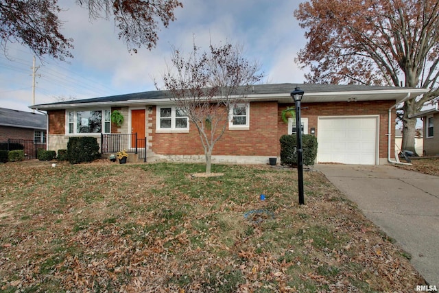 ranch-style home with a front lawn and a garage