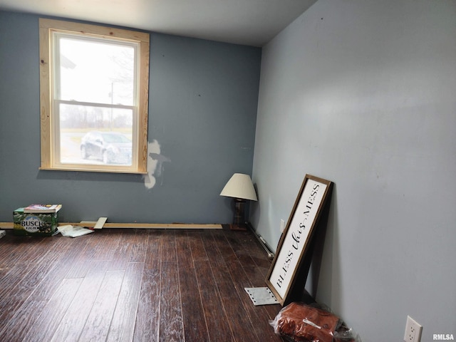 empty room featuring dark hardwood / wood-style floors