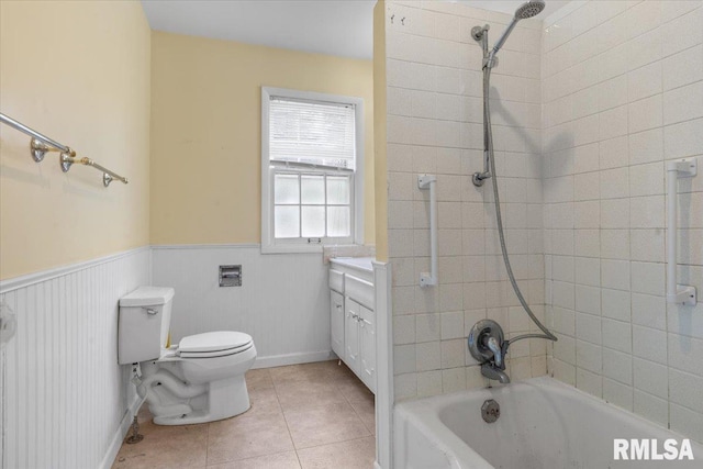 full bathroom with tile patterned flooring, vanity, toilet, and tiled shower / bath