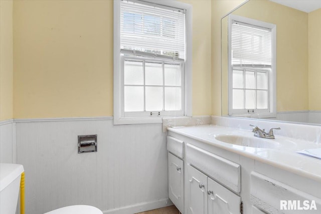 bathroom with vanity and toilet