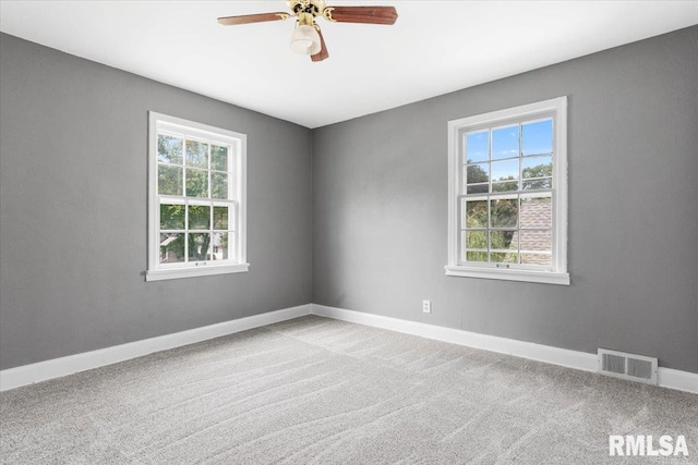 carpeted empty room with ceiling fan