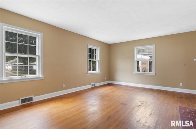 unfurnished room featuring wood-type flooring