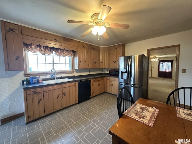 kitchen featuring ceiling fan, sink, black appliances, and brick wall