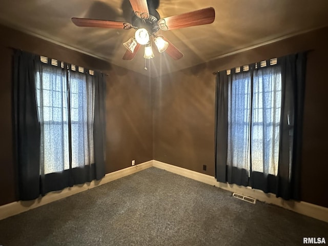 unfurnished room with carpet flooring and ceiling fan