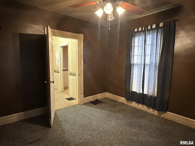 carpeted empty room with ceiling fan