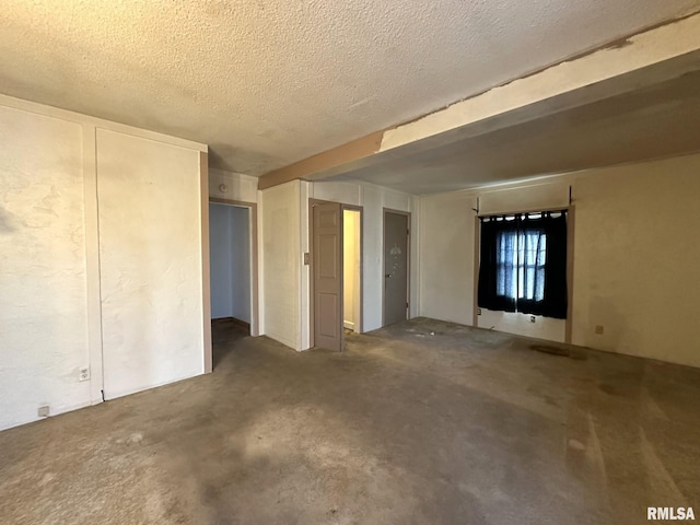 interior space featuring a textured ceiling