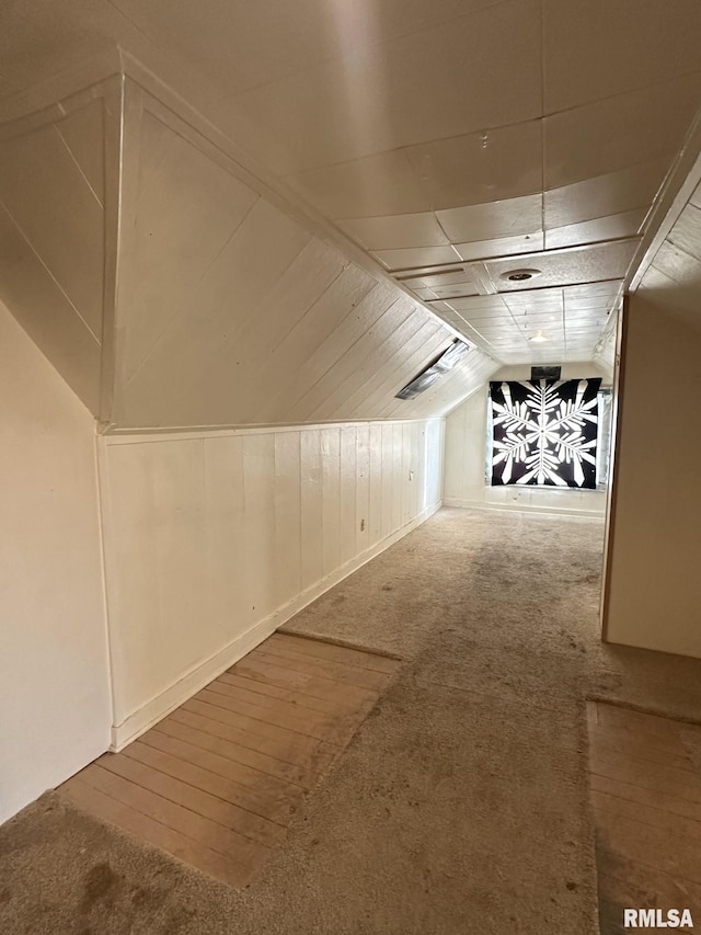 bonus room with carpet and lofted ceiling