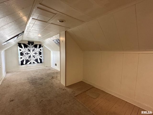 bonus room featuring light hardwood / wood-style floors and lofted ceiling