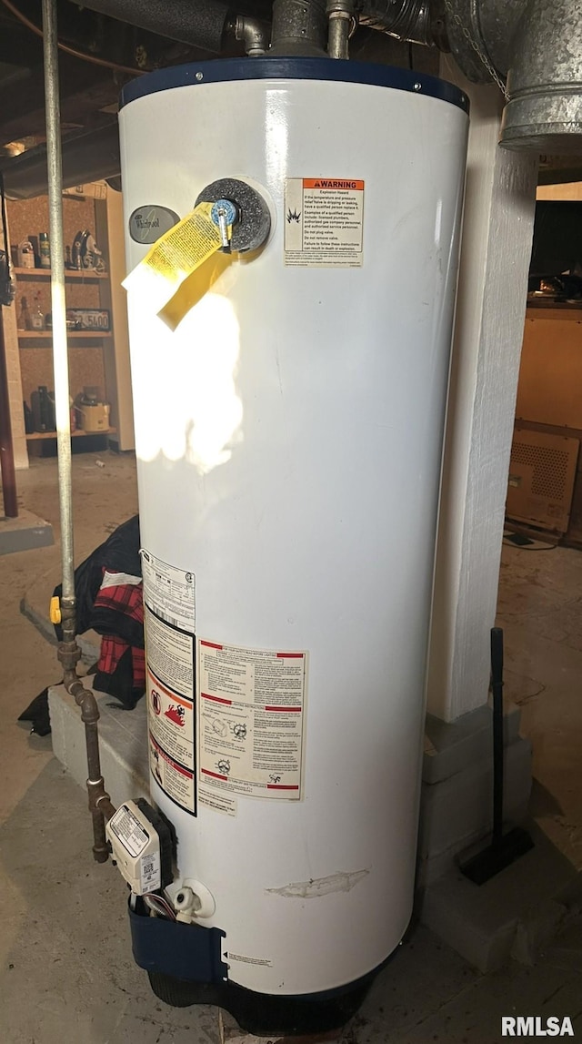 utility room featuring gas water heater