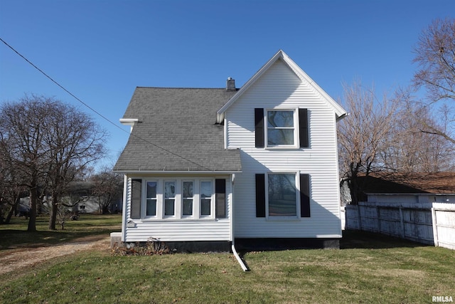 back of house with a yard