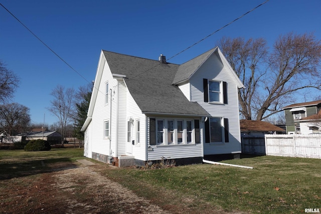 view of side of property featuring a yard